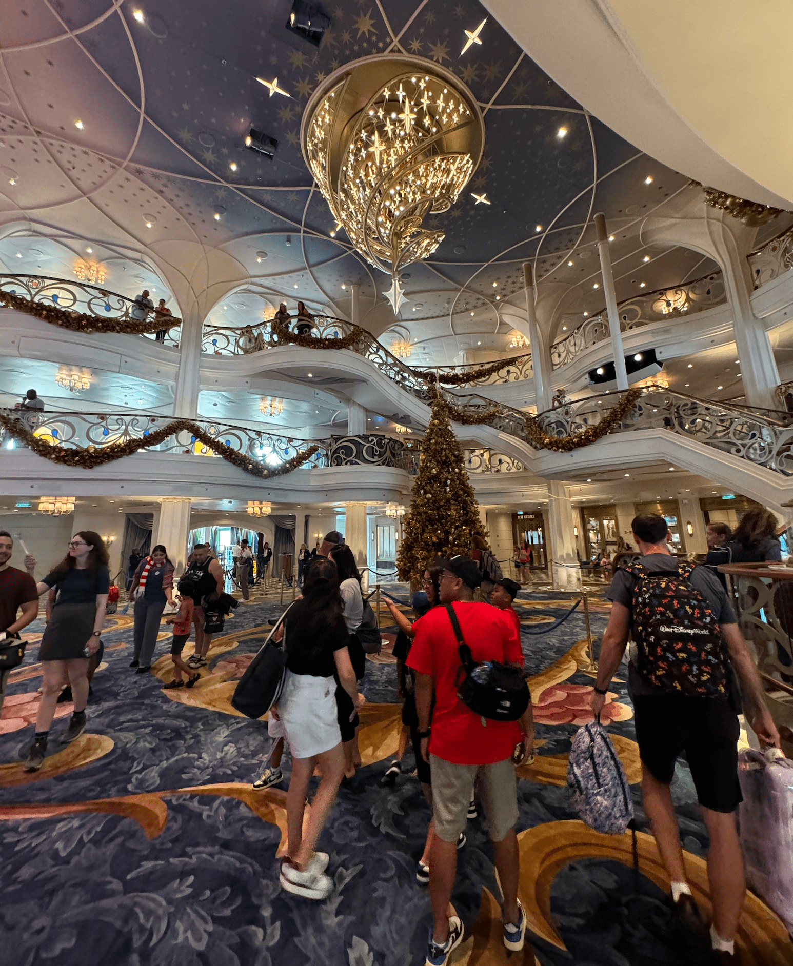 The atrium and chandelier of the Disney Wish