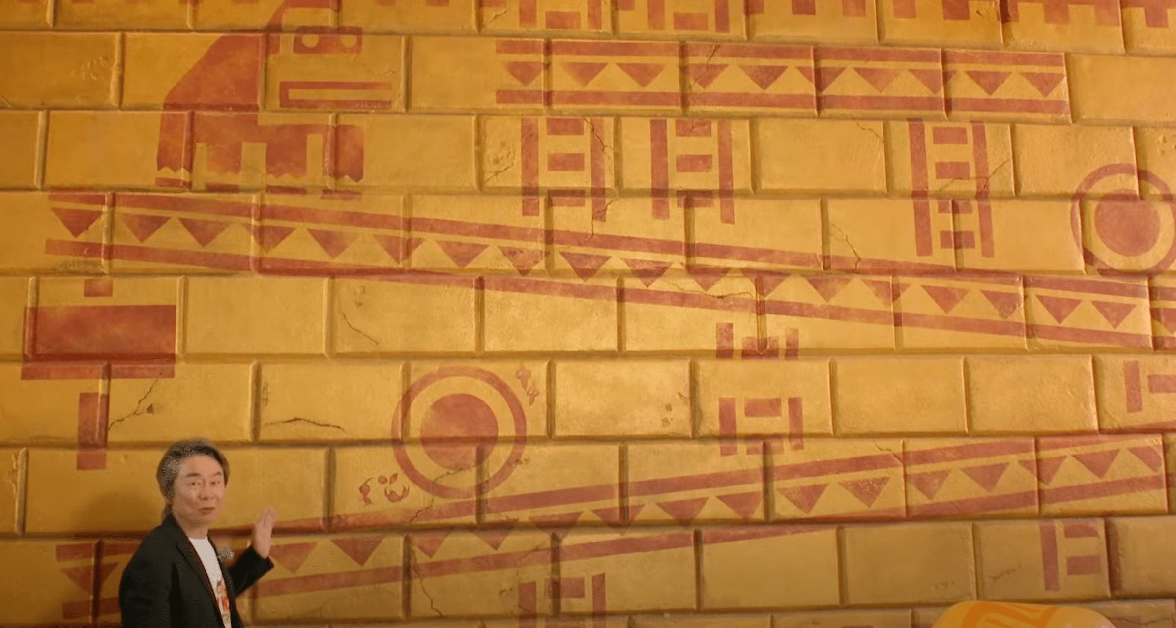 Nintendo's Miyamoto looking at a Donkey Kong Mural at Universal Studios