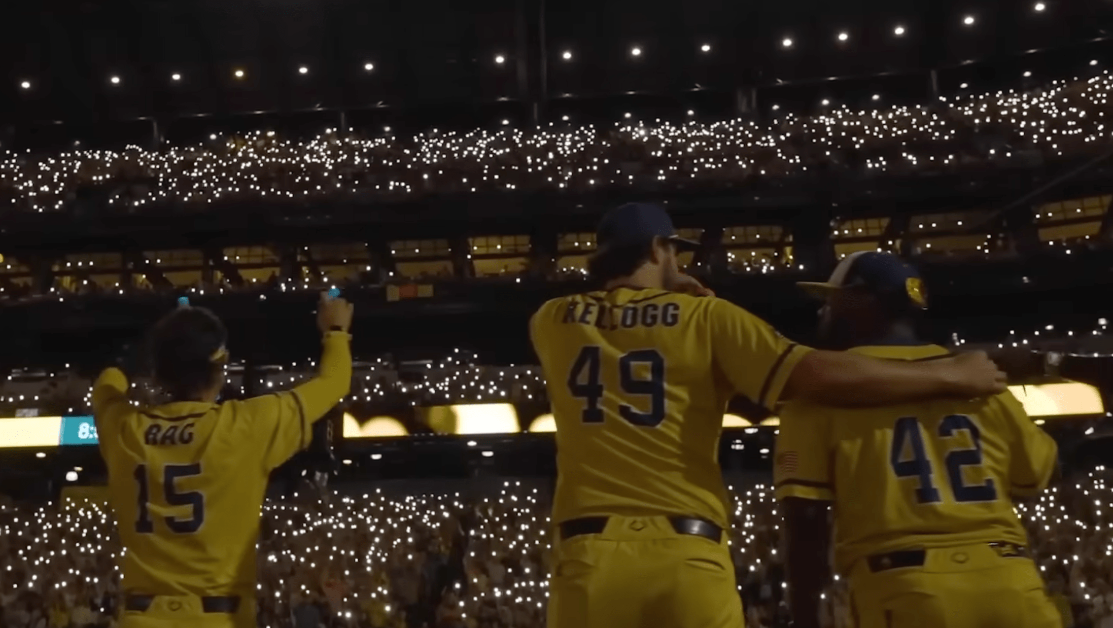 Banana Ball Players in a packed stadium at night