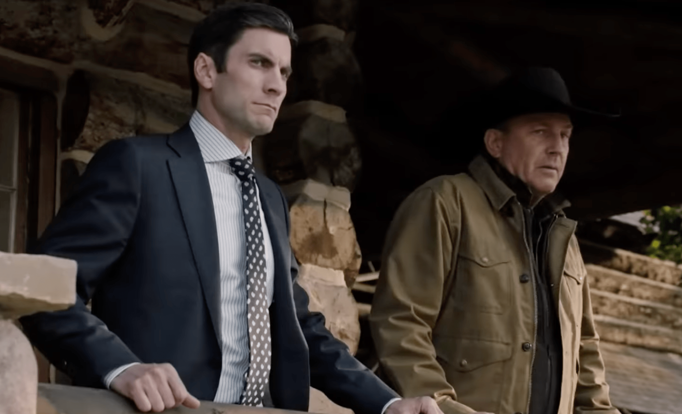 Yellowstone Jamie and John Dutton stand on the ranch