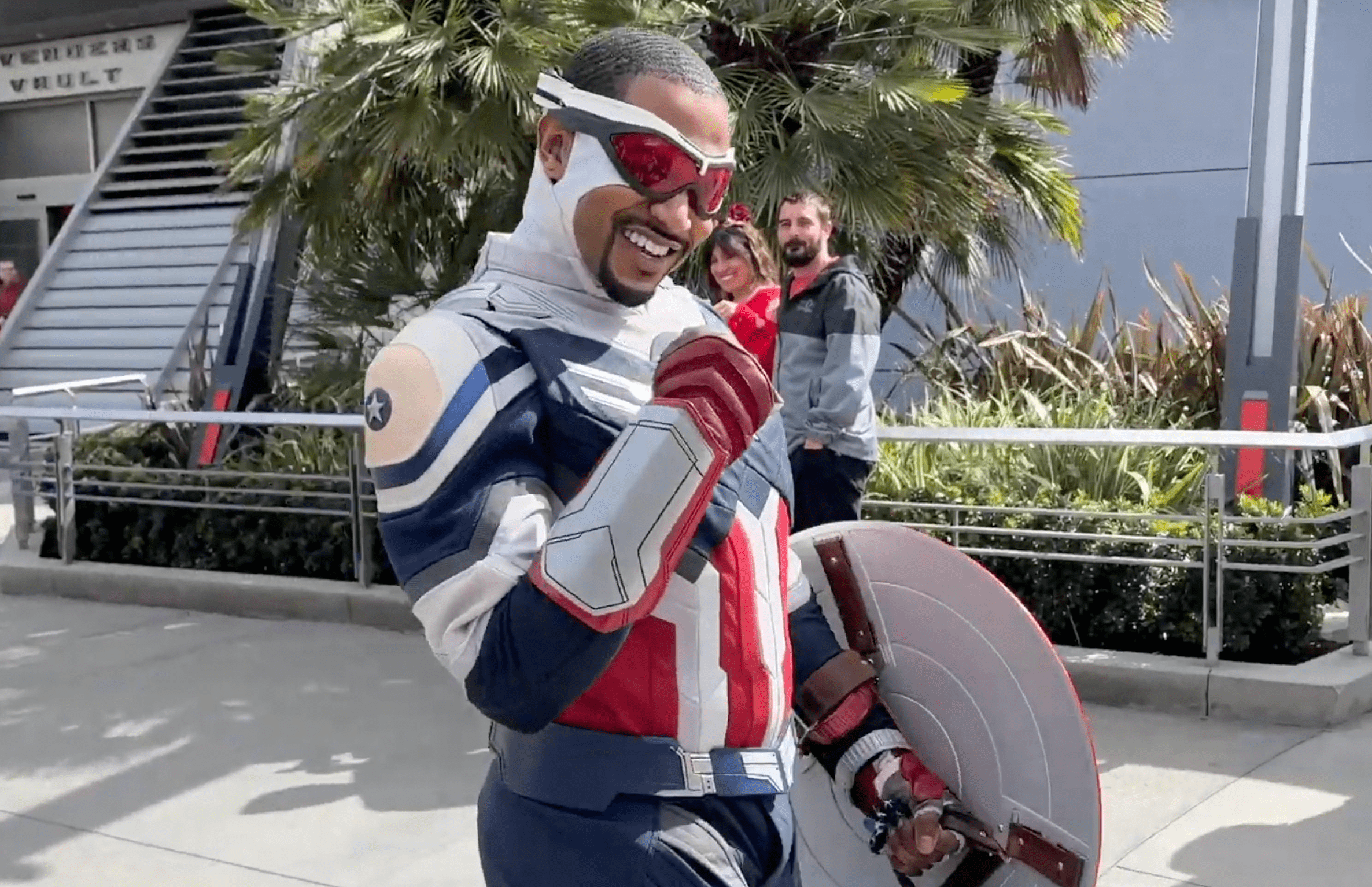 Sam Wilson at Disneyland waving to guests