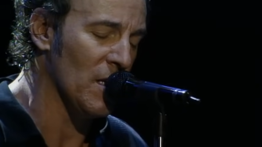 A middle-aged Bruce Springsteen singing sadly