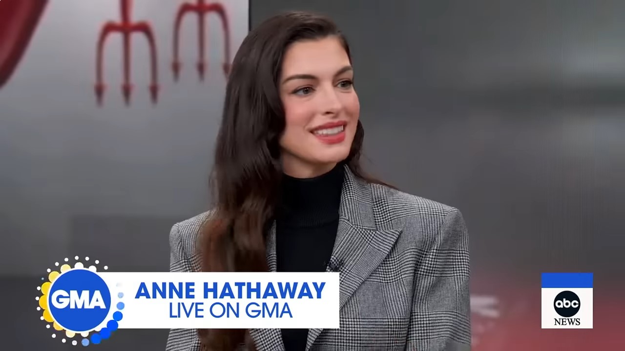 A woman smiles during a morning show interview