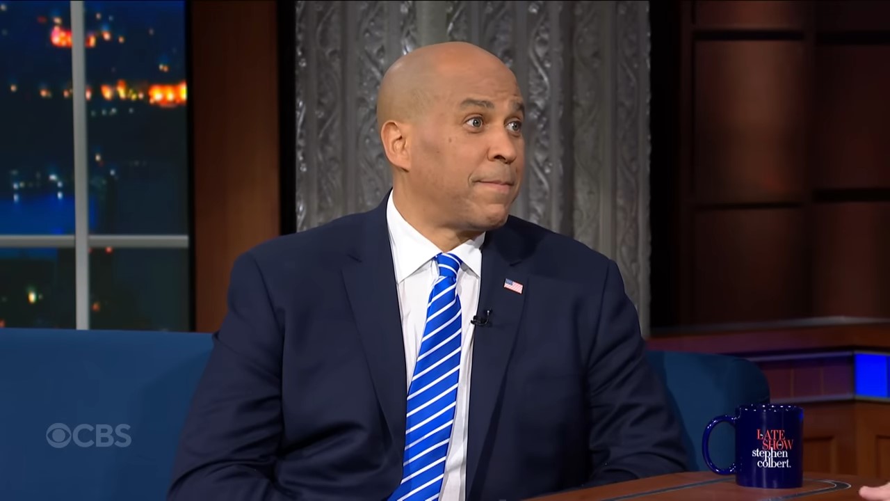 A politician sits in a late night studio with a shocked look on his face