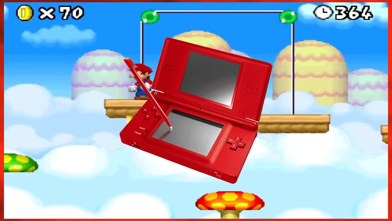 A two-screen handheld video game system against a cartoon background
