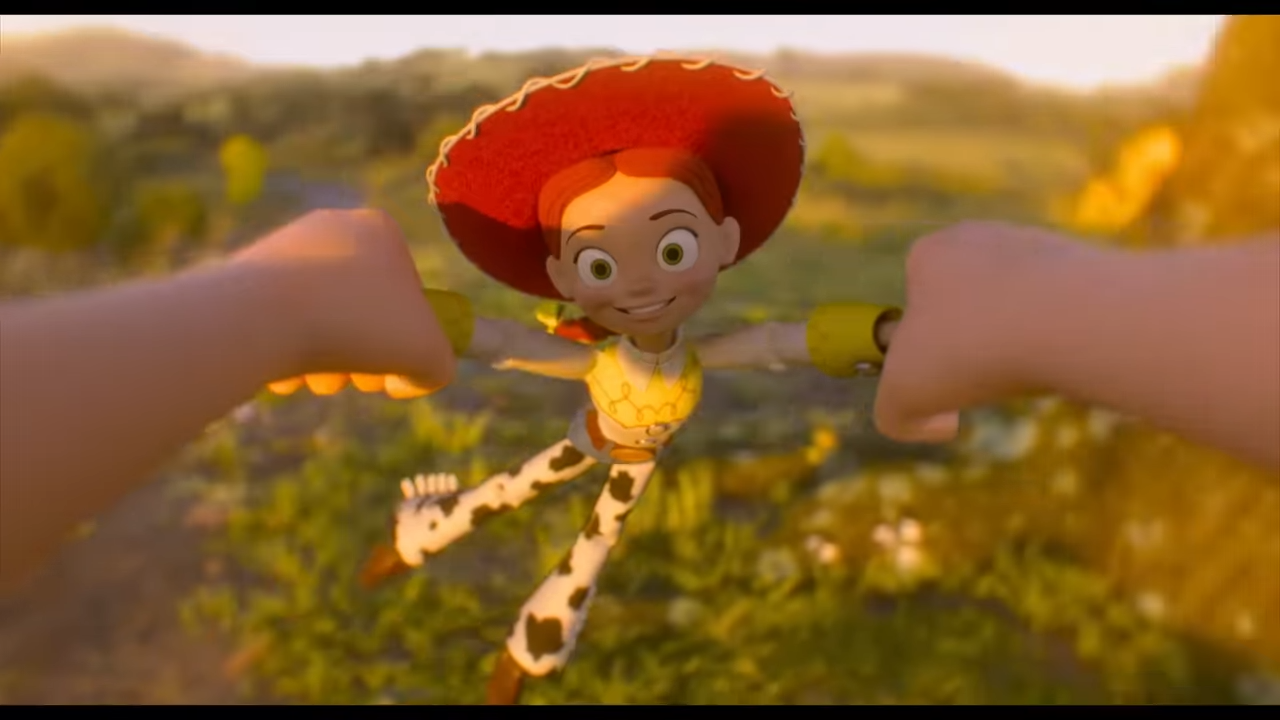 Jesse the cowgirl in toy form happily being spun in the air