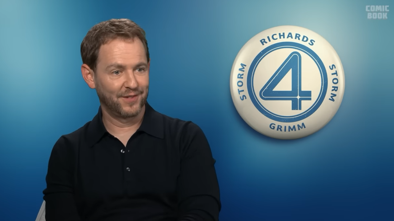 Matt Shakman in an Interview with the Fantastic Four logo behind him