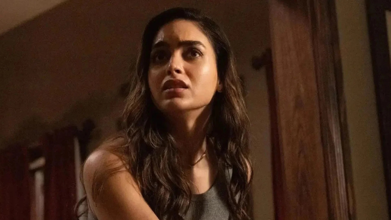 A young woman in profile, exhibiting fear