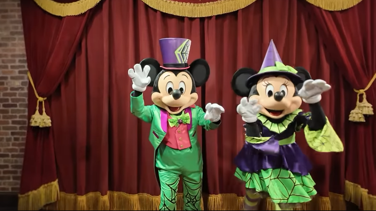 Mickey and Minnie Character Meet-and-Greet for Mickey's Not-So-Spooky Halloween, with arms up to "spook" the camera