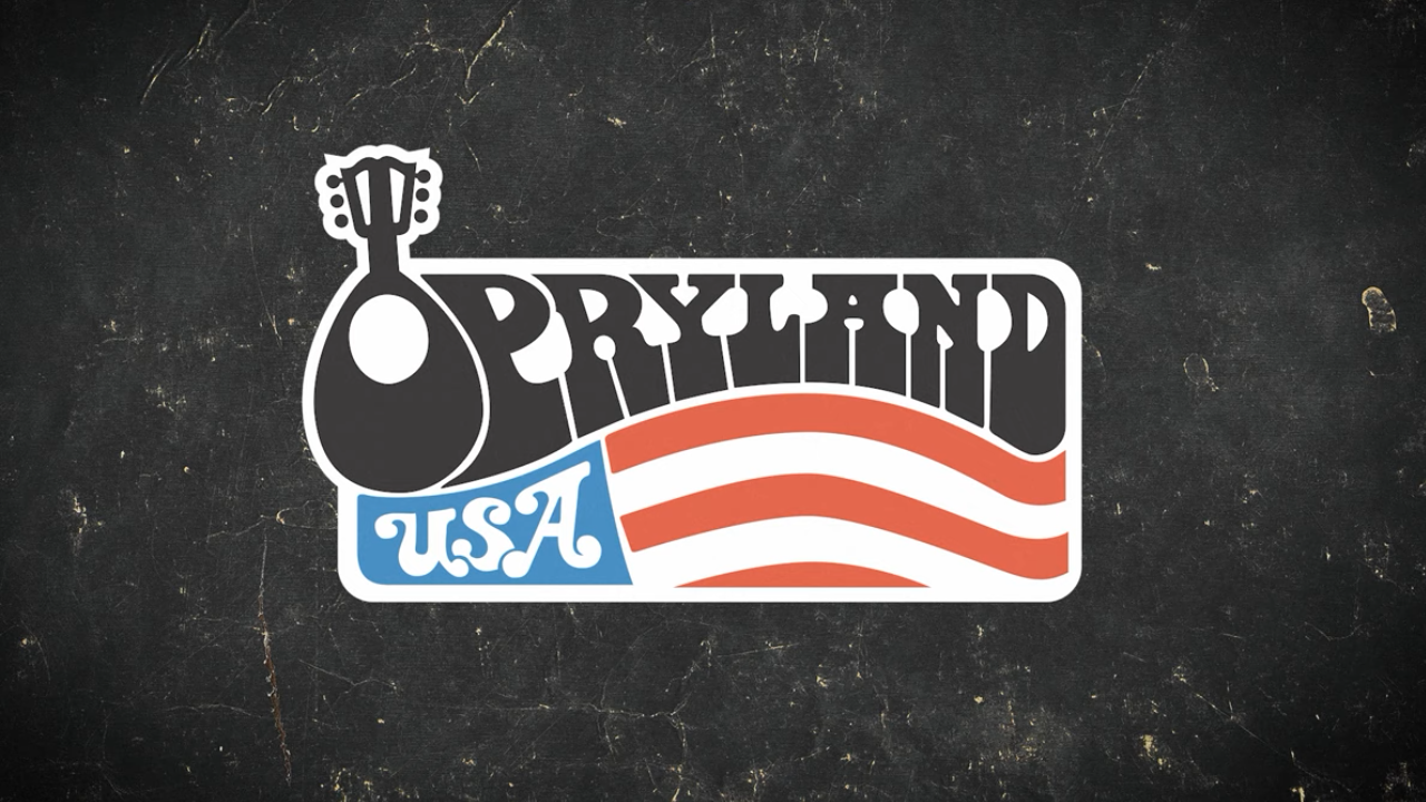 Opryland USA Logo with O as a Guitar and partial American flag at the bottom of the logo