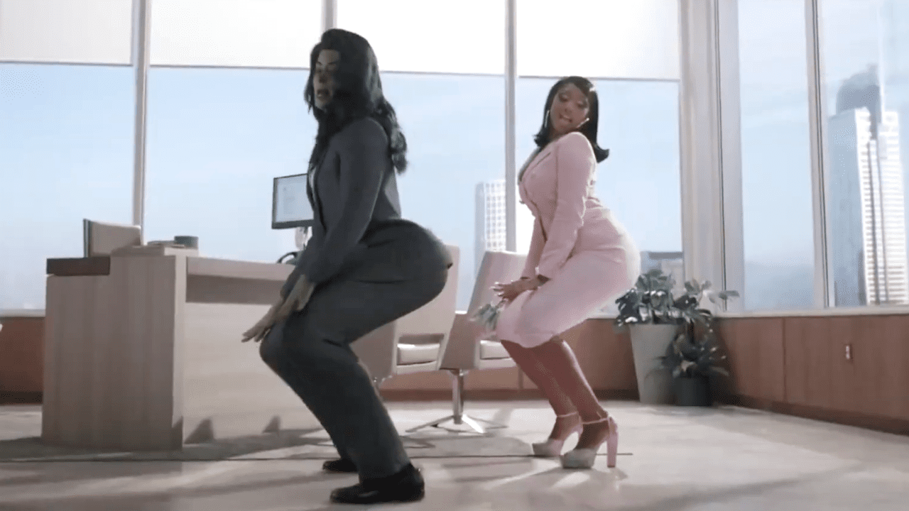 Two women twerk in an expensive office