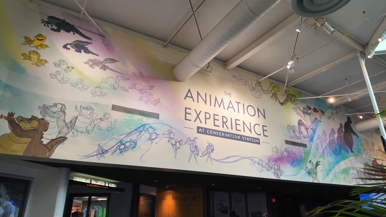 The Animation Experience with animals and characters painted around the sign