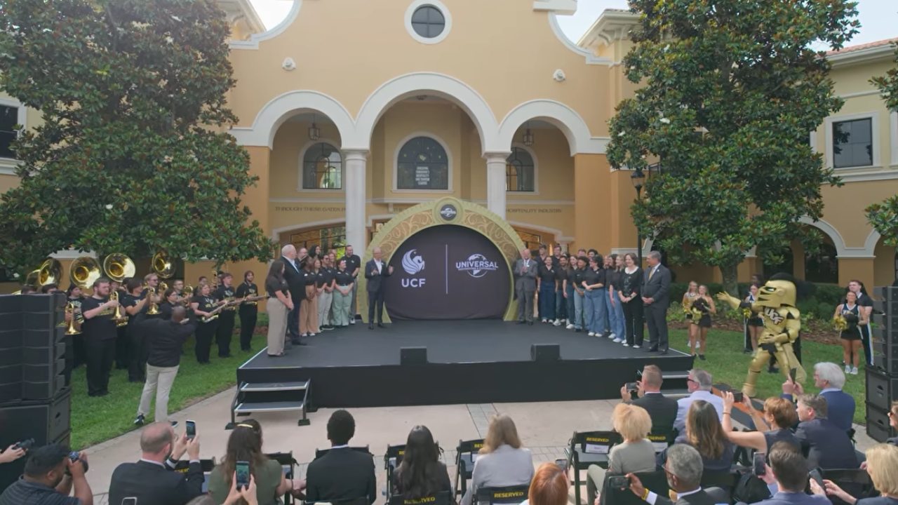 Opening Ceremony for the Opening Ceremony the Universal School of Experience Leadership and Innovation - YouTube, Universal Destinations and Experiences, with officials and students on stage before an audience