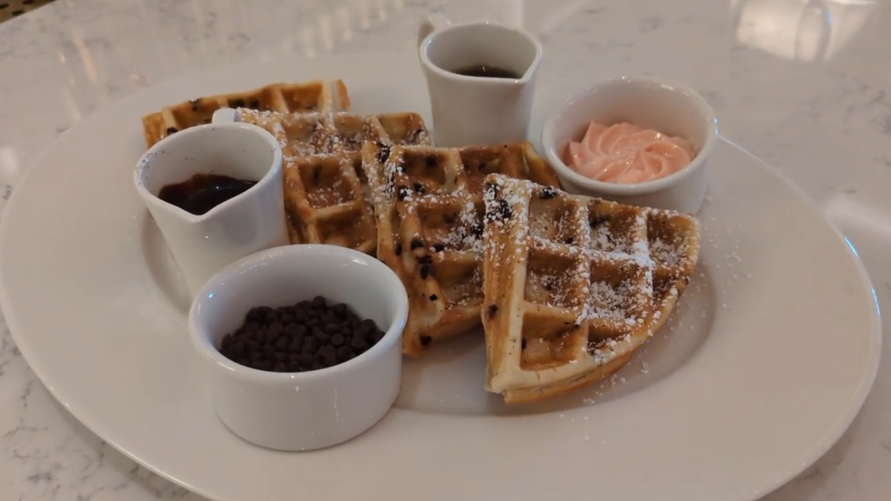 Plate of powdered waffles with toppings