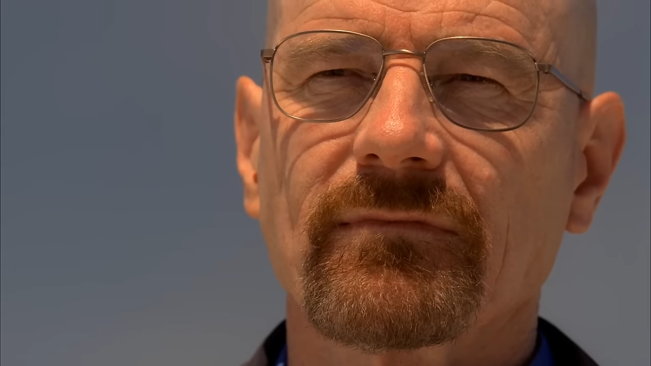 (137) Breaking Bad – Say My Name Scene (S5E7) Rotten Tomatoes TV 00-02-54 A bald man with glasses and goatee squints in the sun, menacingly