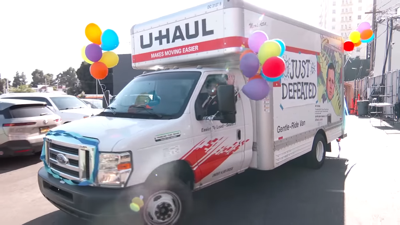 A U-Haul truck with balloons