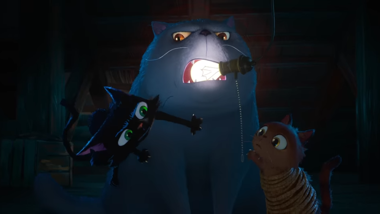 Three cartoon cats fighting over a lightbulb