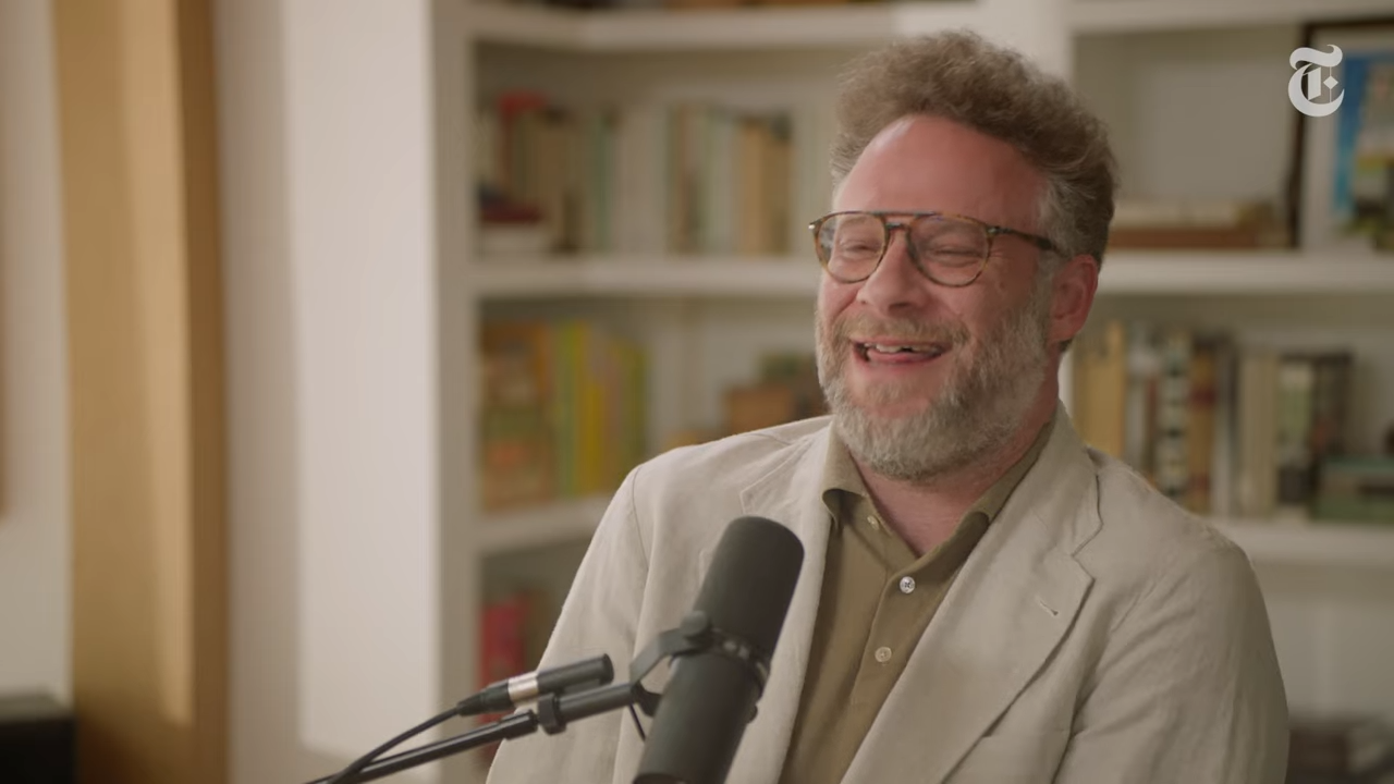 A man laughs during a podcast interview