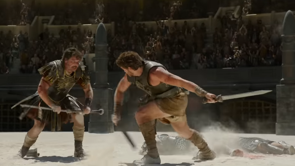 Two gladiators fight with swords in the arena