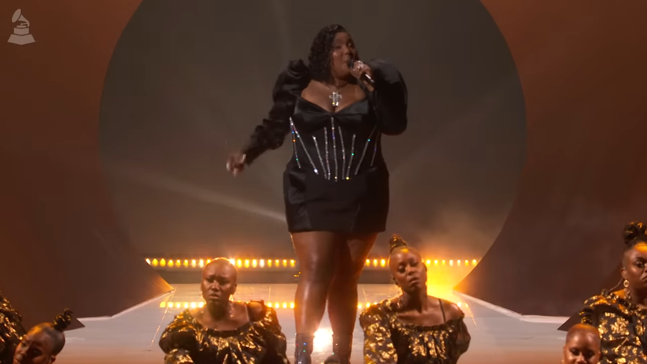 A woman sings at an awards ceremony