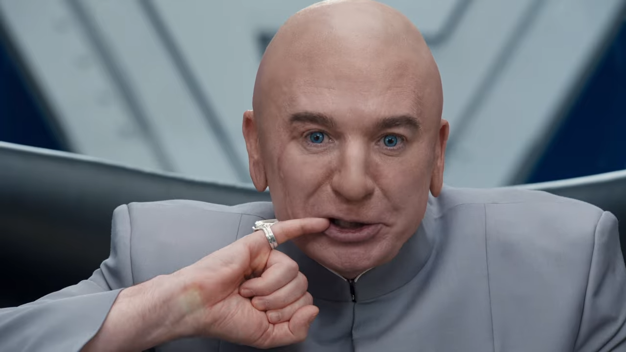 A bald villain in his evil lair puts his pinky finger to the corner of his mouth