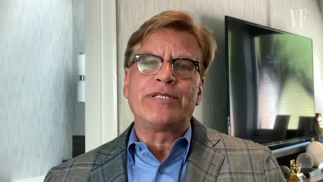 Aaron Sorkin speaks into his webcam from his living room