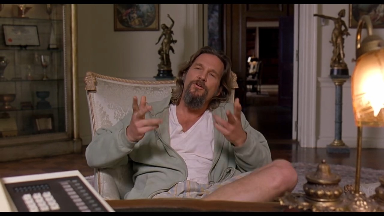 Jeff Bridges in an undershirt and bathrobe 