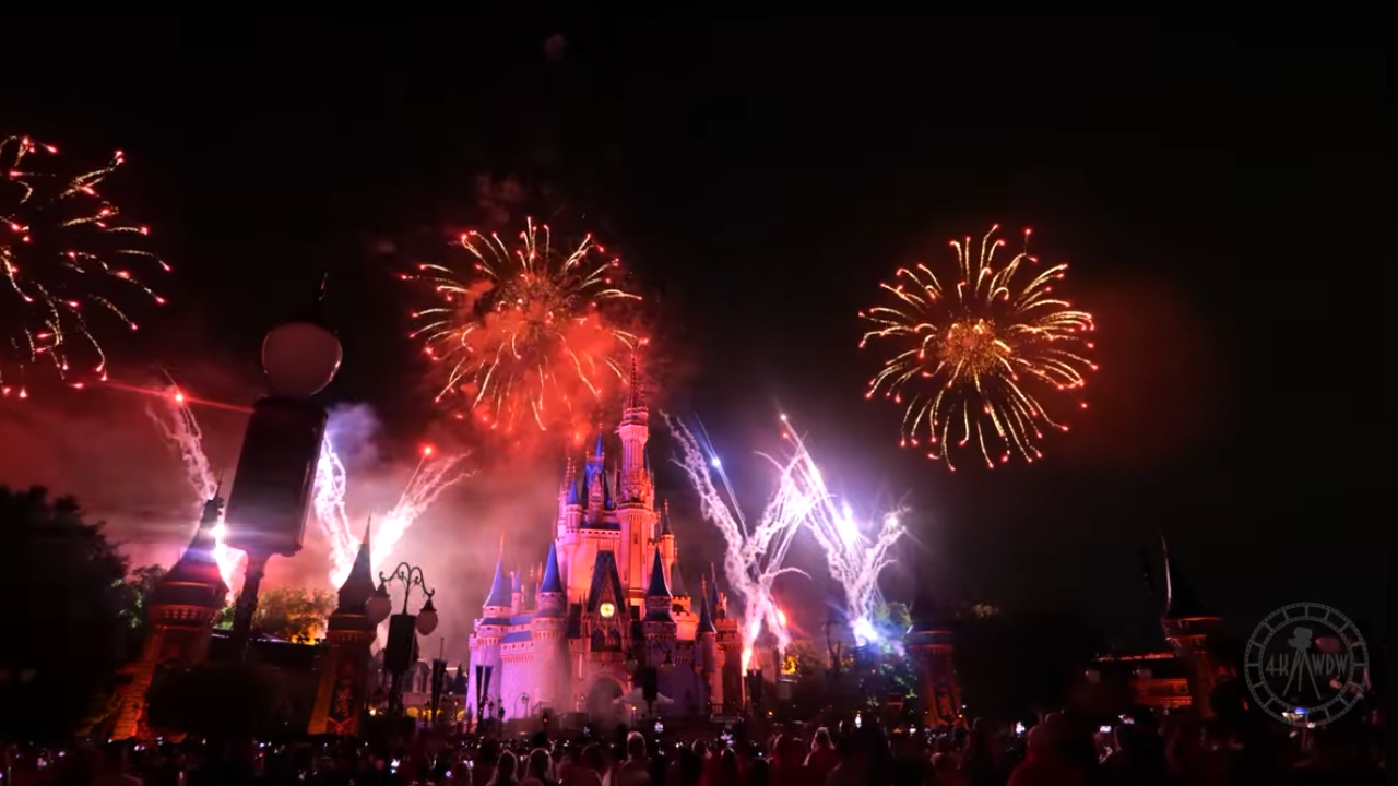 Cinderella's Castle with red fireworks accented with white and blue