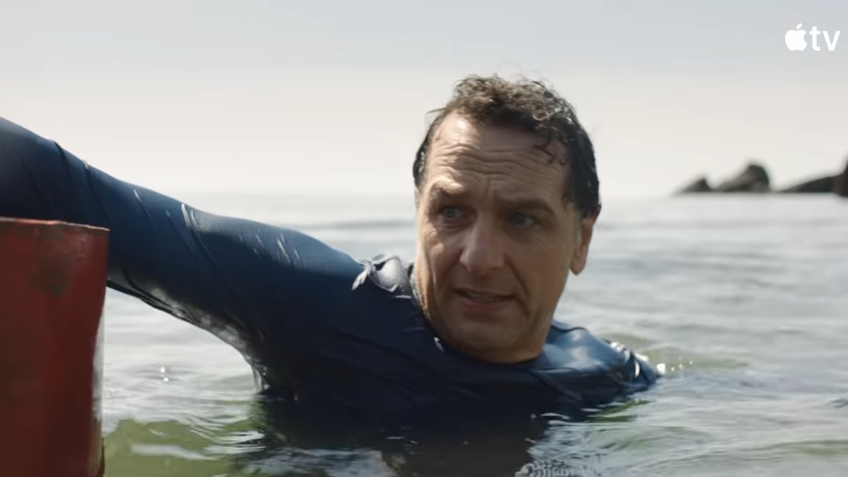 A man in the water looks afraid