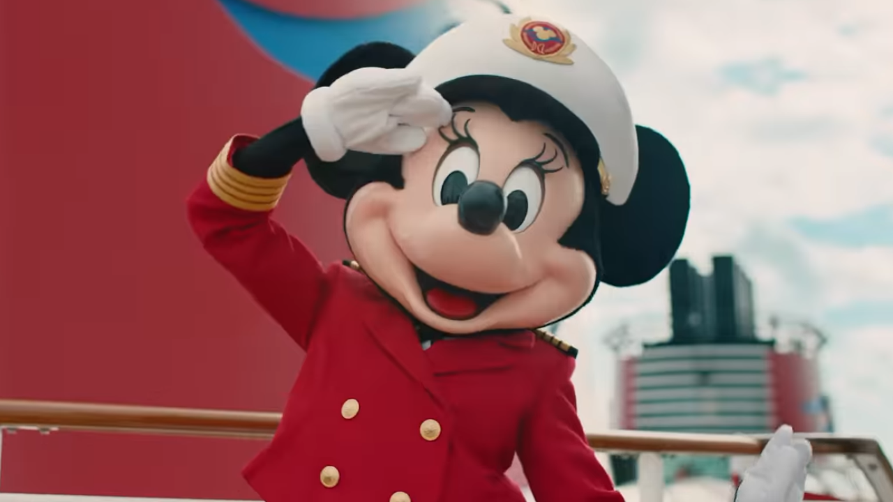 Minnie Mouse Disney Cruise Line Minnie Mouse saluting the camera in red suit and captain's hat