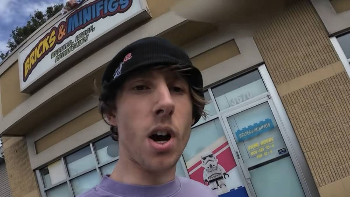 Reckless_Ben_Store A young man speaks directly into a phone camera outside a Bricks & Minifigs store