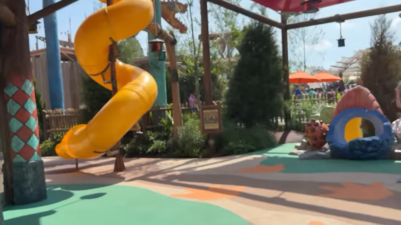 Large yellow slide in shaded area