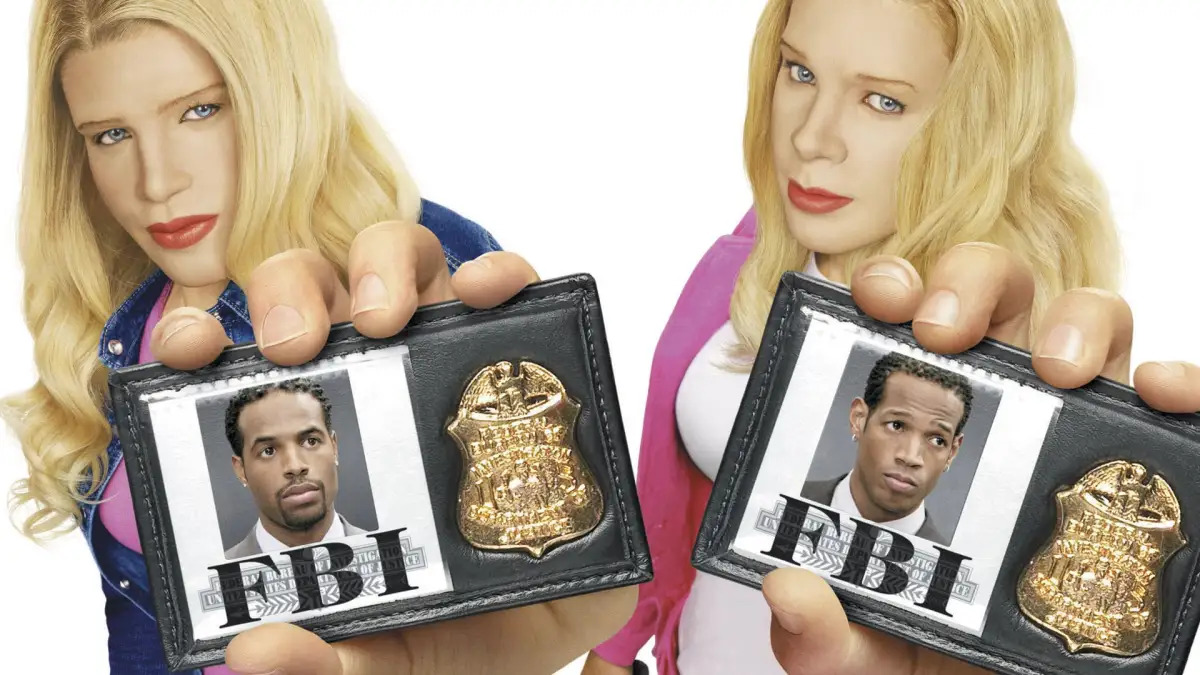 White-Chicks Two blond, white woman hold FBI badges showing black men