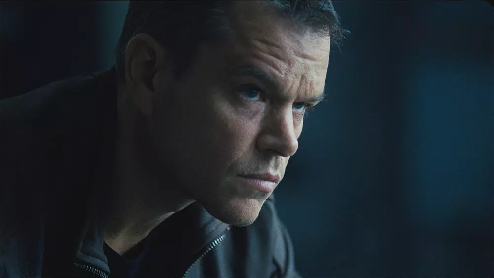 A man in profile looks very somber