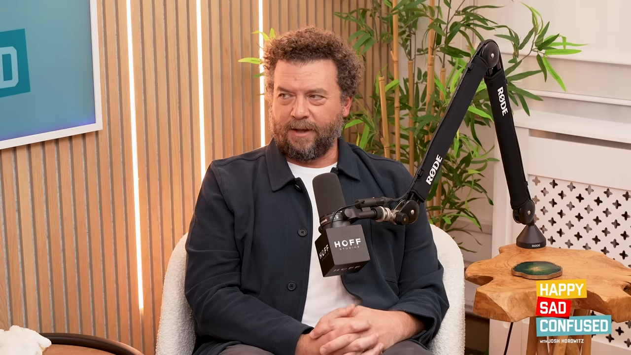 Danny McBride seated for a podcast