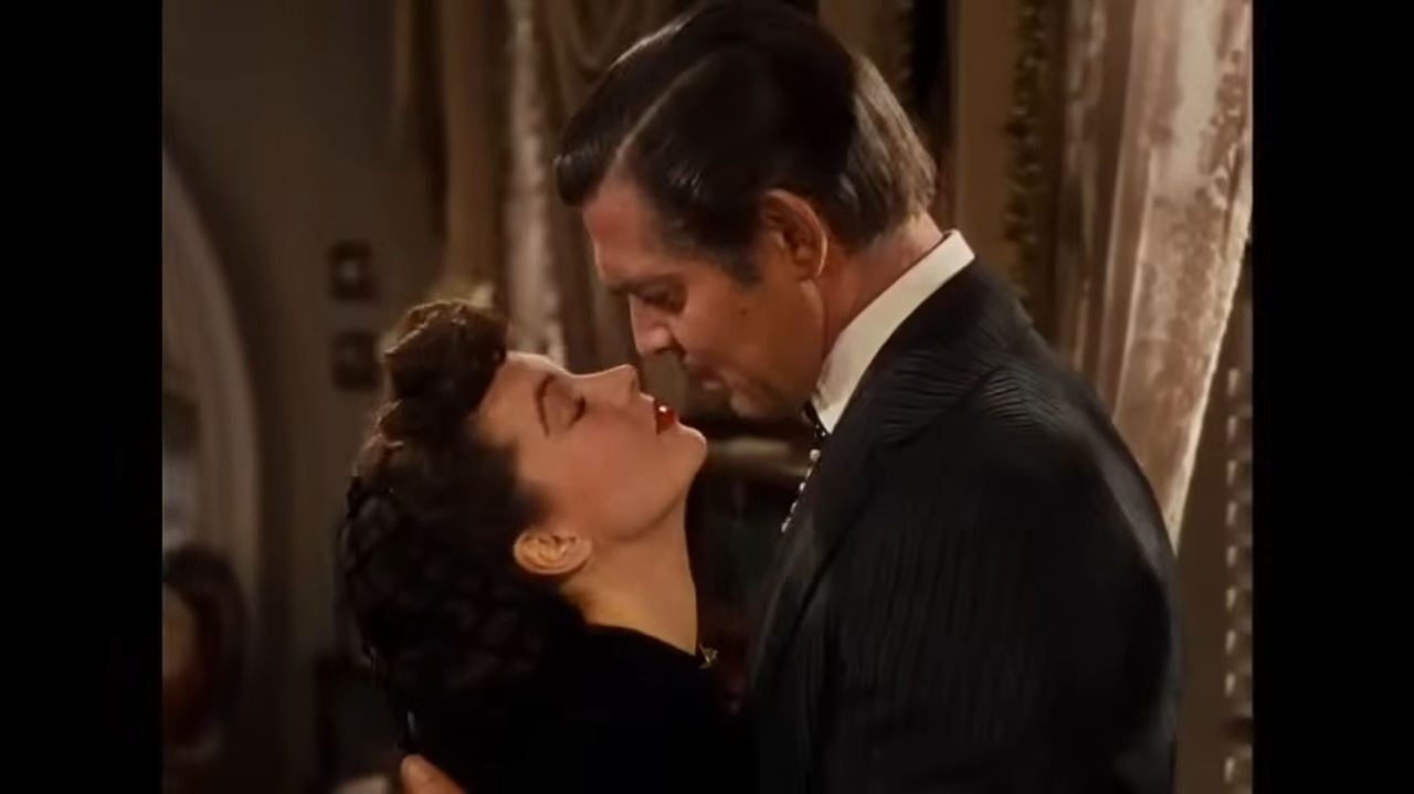 A man and woman about to kiss