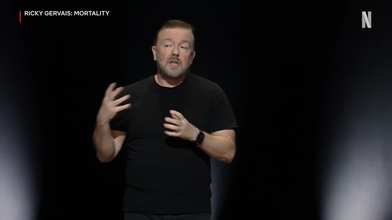 Ricky Gervais performing stand-up comedy