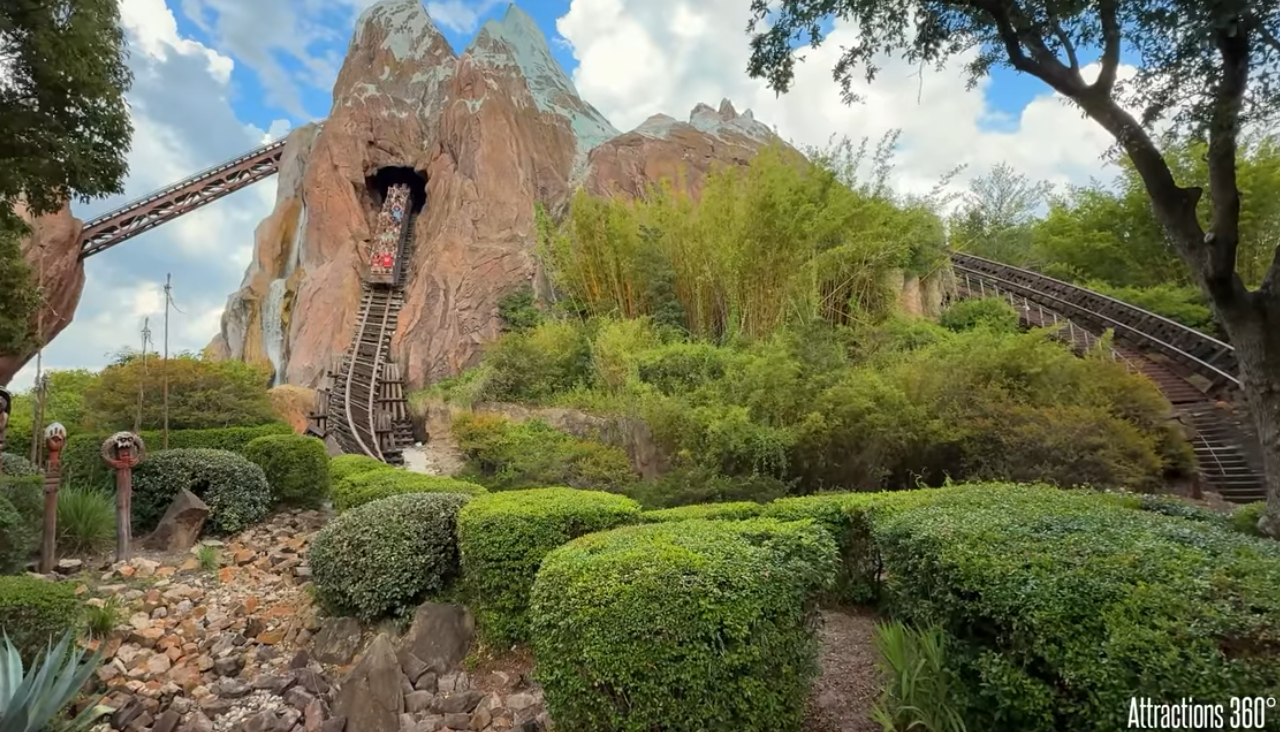 Shot of Expedition Everest showing train car coming out of the mountain