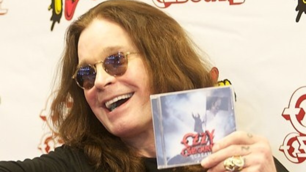 Ozzy holding a CD