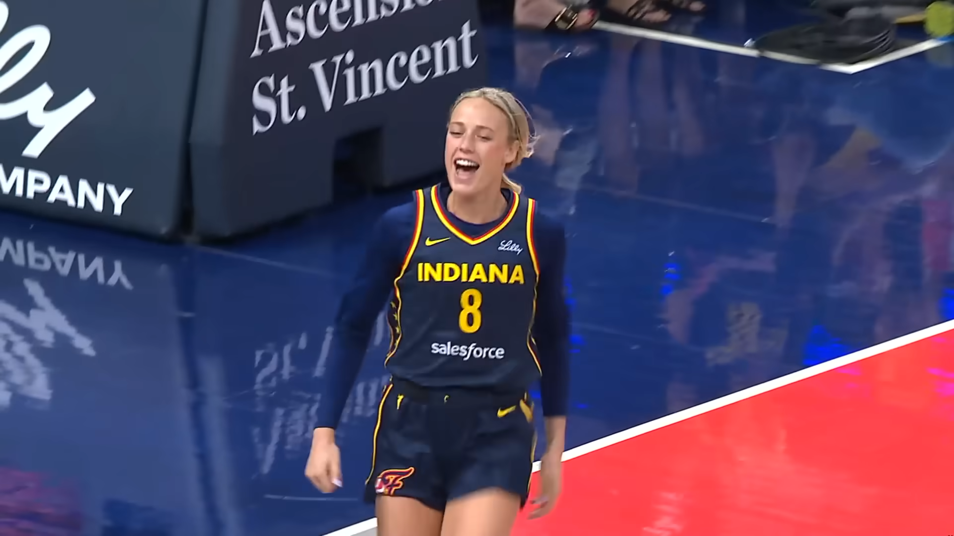 Sophie Cunningham on the basketball court running and laughing