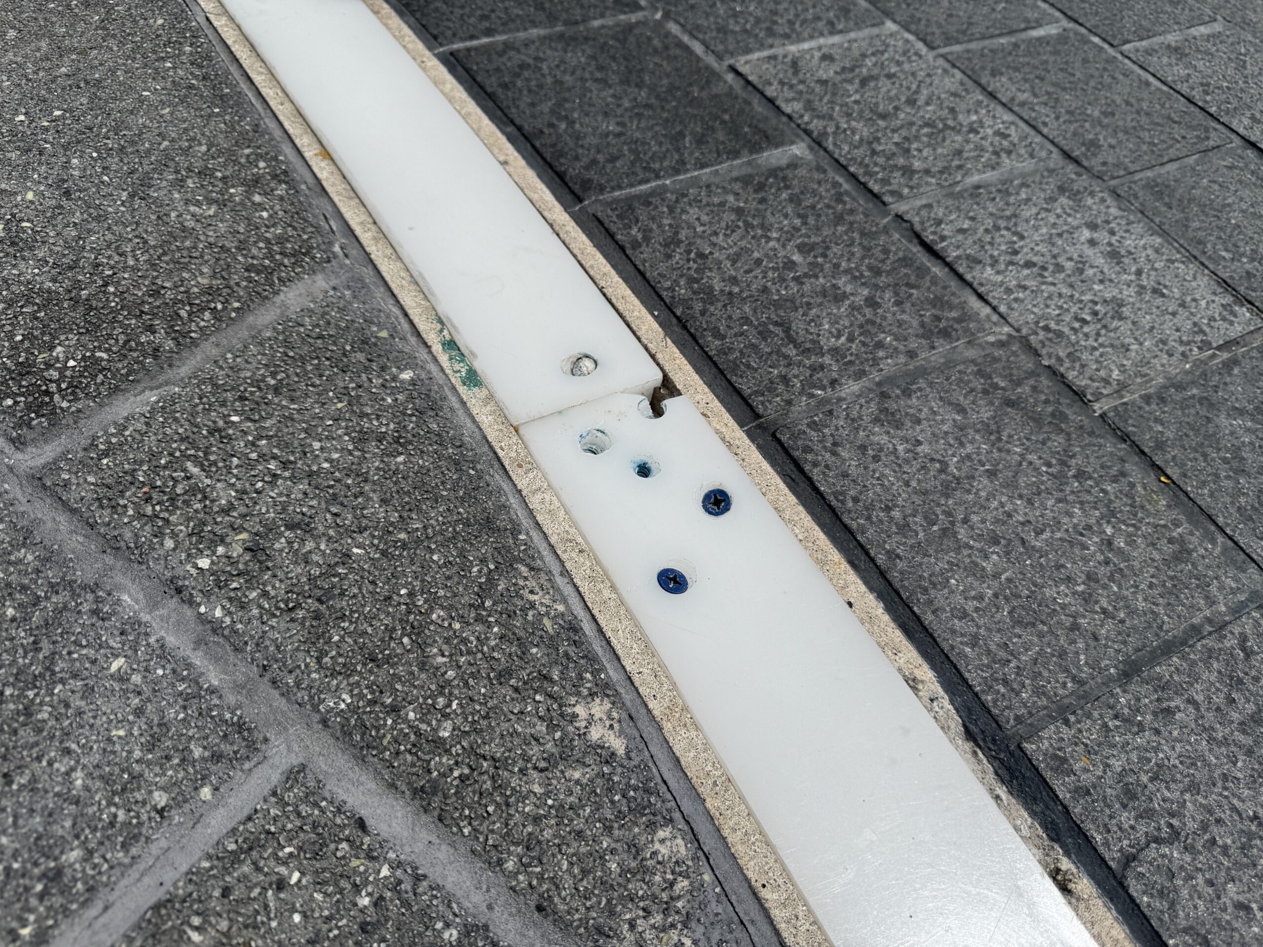 Epcot lighting strip screwed in place