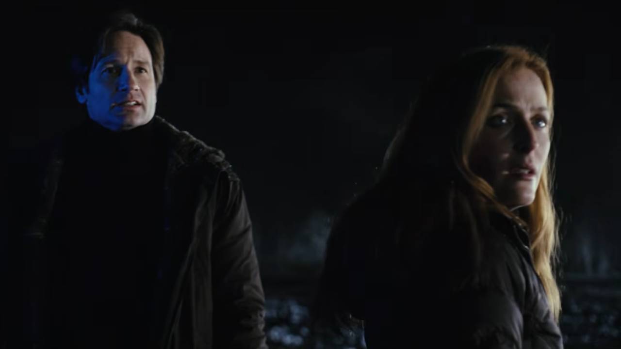 Mulder and Scully A man and woman outside at night looking at something startling.