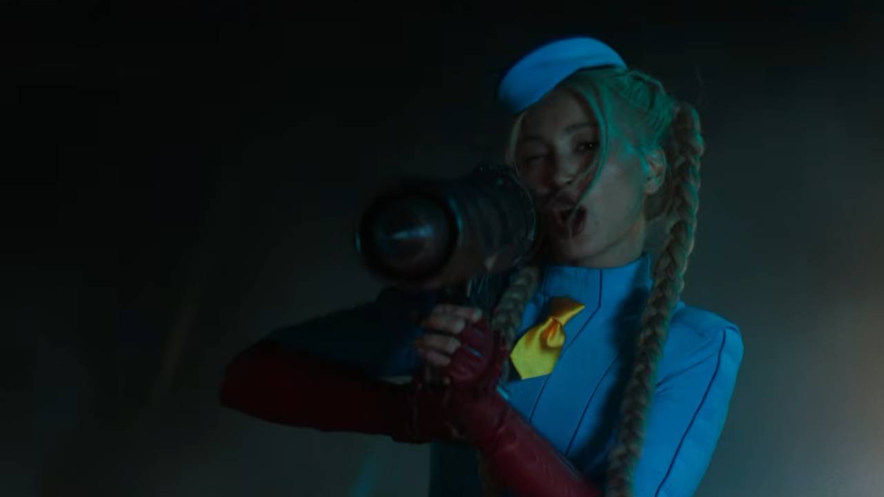 A woman holds a rocket launcher