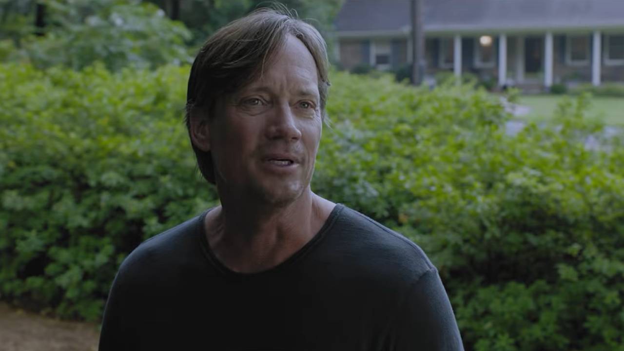 Kevin Sorbo stands outside