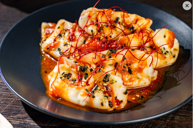Chicken and dumplings garnished colorfully