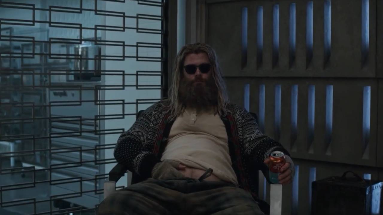 Fat Thor in sunglasses and an open sweater
