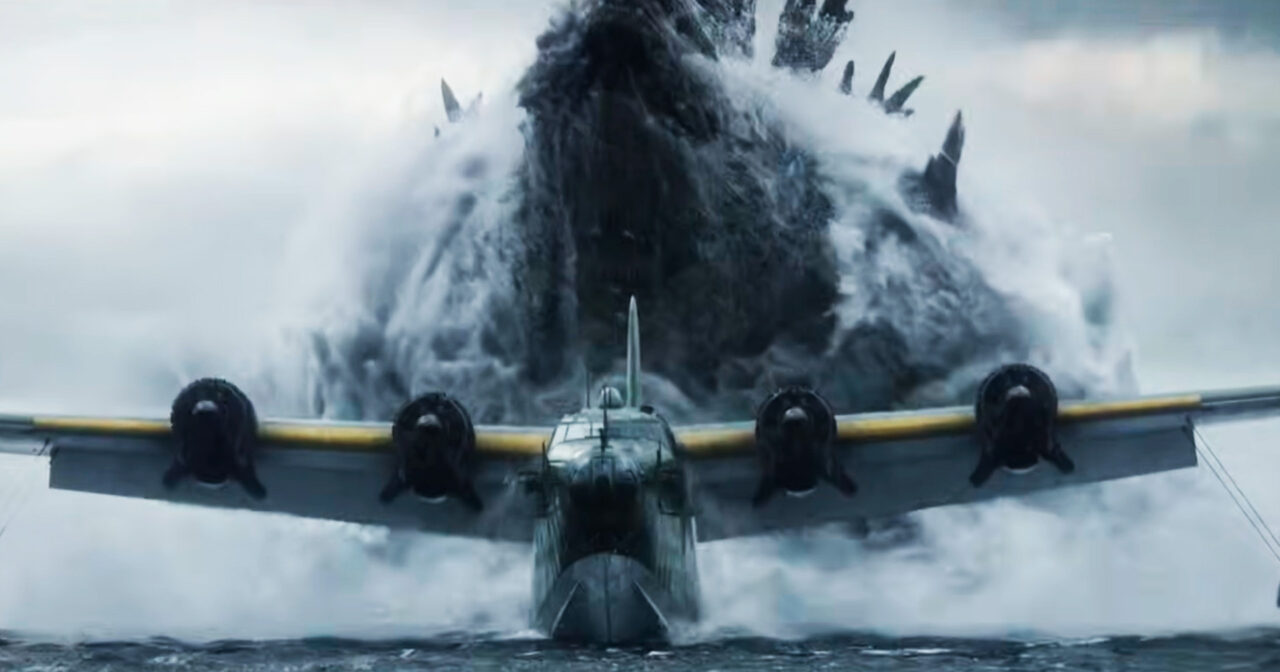 Godzilla erupts from the ocean over a huge airplane