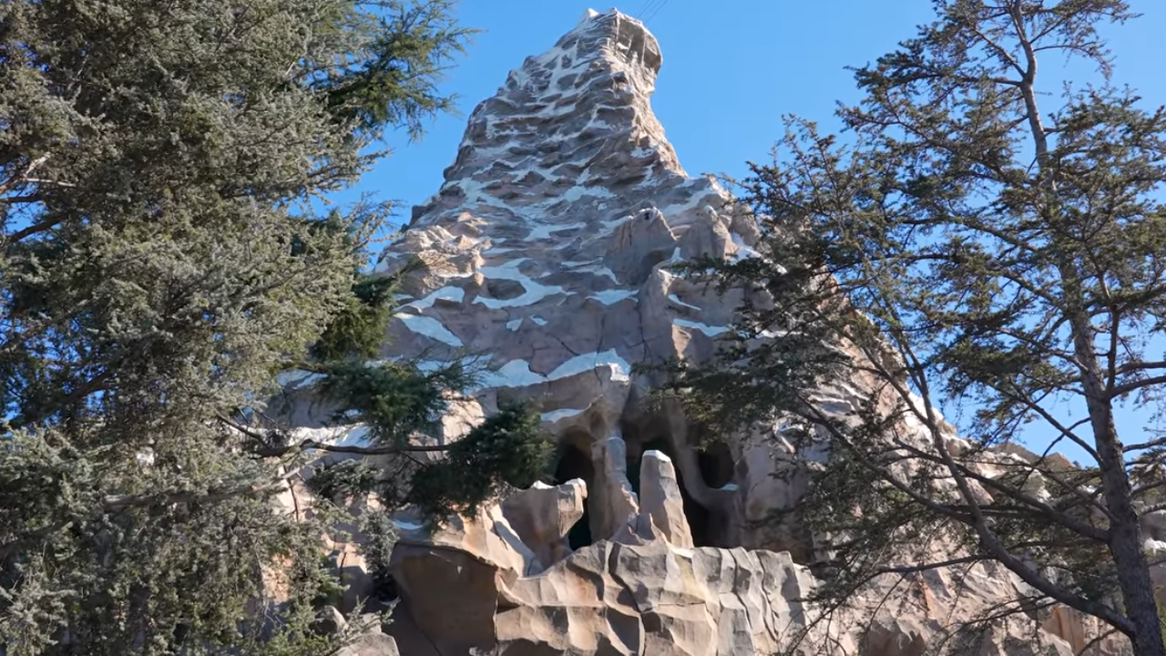 Matterhorn Bobsleds Disneyland Large snowy mountain between trees