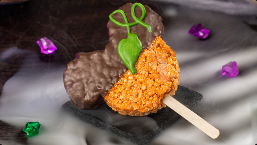 Mickey-shaped cereal treat, half-dipped in chocalate