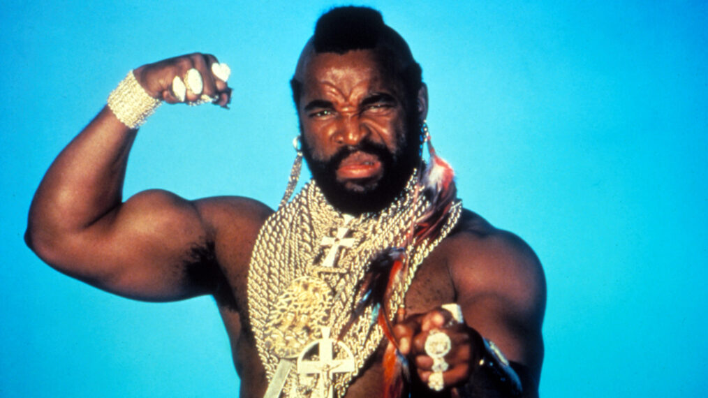 Mr T wearing gold chains and flexing